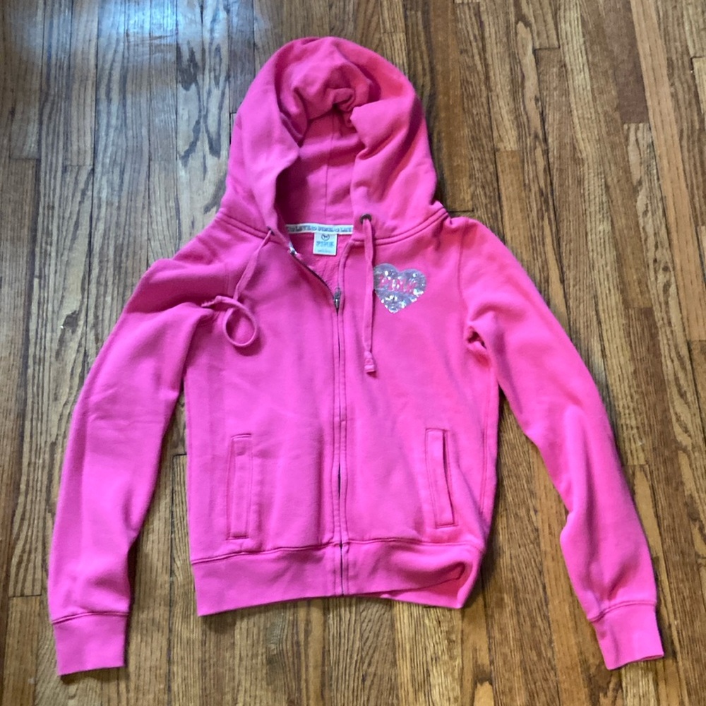 Pink size Small pink zip up hooded sweatshirt.
